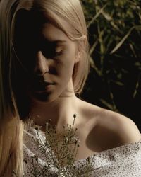 Close-up of thoughtful young woman at night