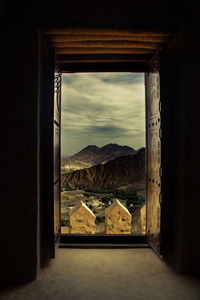 Buildings seen through arch window