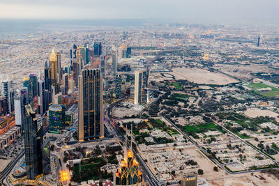 High angle view of modern buildings in city against sky