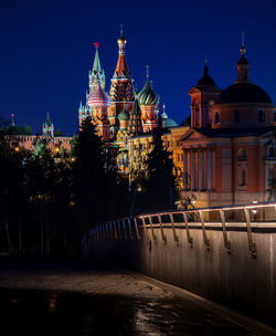 Illuminated buildings in city at night