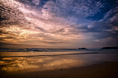 Scenic view of sea against sky at sunset