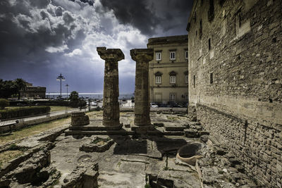 Old building against cloudy sky