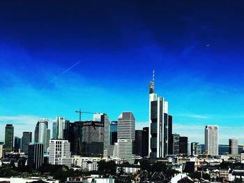 View of skyscrapers against blue sky