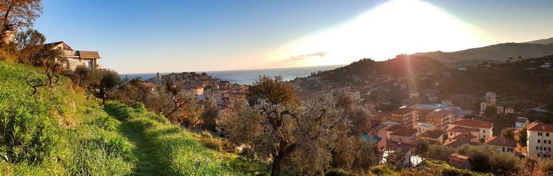 Panoramic view of townscape against sky at sunset