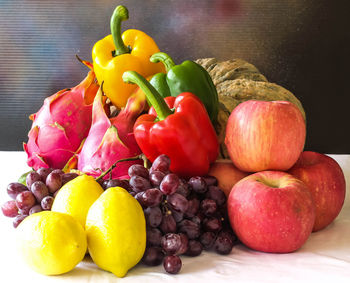 Close-up of apples and fruits on table