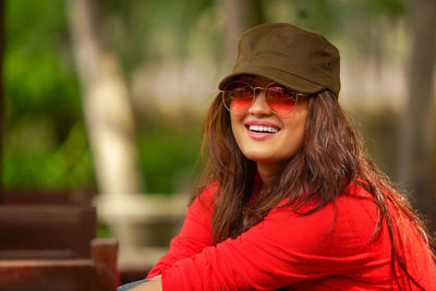 Portrait of young woman standing outdoors