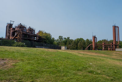 Built structure on field against clear sky