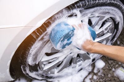 High angle view of person hand holding water