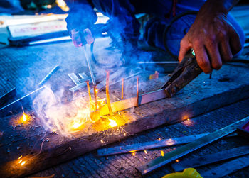 Welder at work in factory