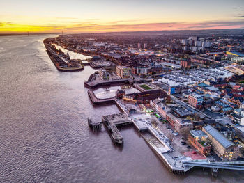 High angle view of river amidst buildings in city