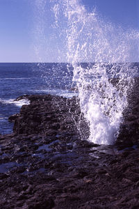 Waves splashing on rocks