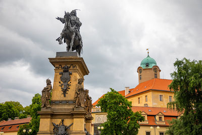 Low angle view of statue against building