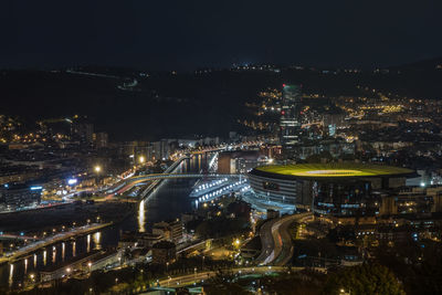 High angle view of illuminated buildings in city at night