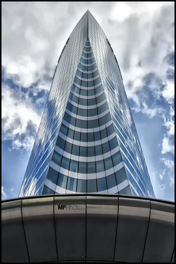 architecture, modern, low angle view, built structure, building exterior, skyscraper, office building, tall - high, sky, glass - material, city, tower, cloud - sky, reflection, tall, cloud, building, day, cloudy, travel destinations