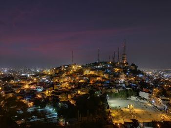 High angle view of city buildings at night