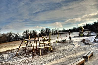 Playground in park against sky