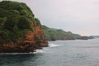 Java seaside bounded by rock cliffs
