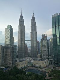 Modern buildings in city against sky