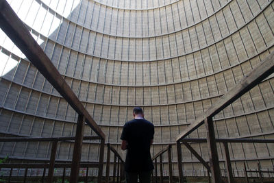 Rear view of man on ceiling