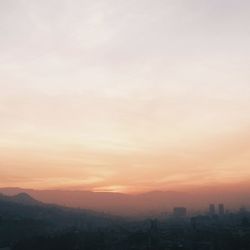 View of cityscape at sunset