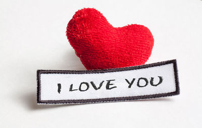 Close-up of heart shape with text on white background