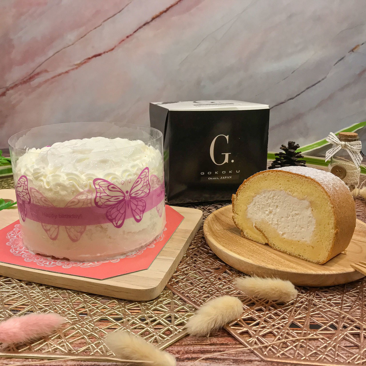 CLOSE-UP OF CAKE ON TABLE AGAINST WALL