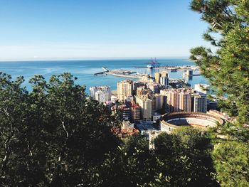 High angle view of city by sea