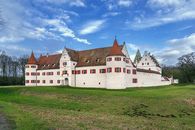 House on field against sky