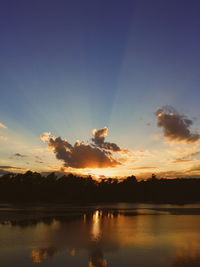 Scenic view of lake at sunset