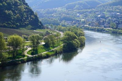 Scenic view of river by mountains