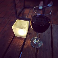 High angle view of wine in glass on table