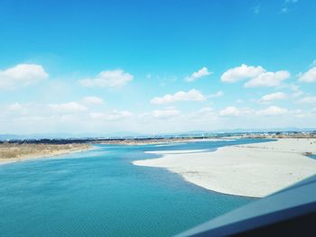 Scenic view of sea against blue sky