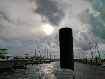 Boats in sea against sky