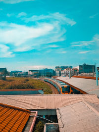 High angle view of houses and buildings against sky