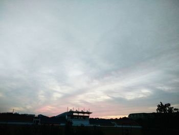 Silhouette buildings against sky during sunset