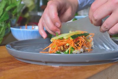 Close-up of hand preparing food