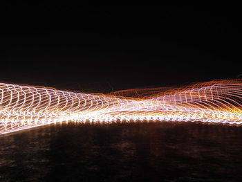 Light trails against sky at night