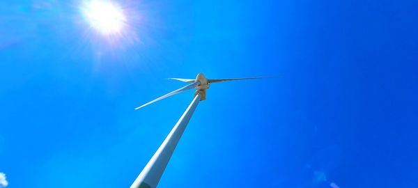 Low angle view of wind turbine against sky