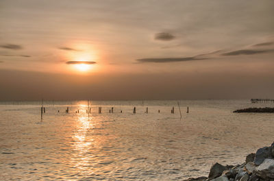 Scenic view of sea at sunset