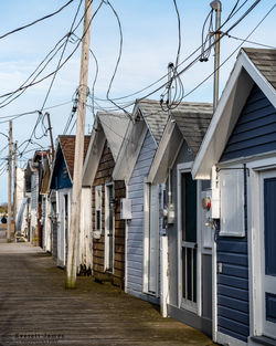 Boat houses next to each other on a dock in the finger lakes.