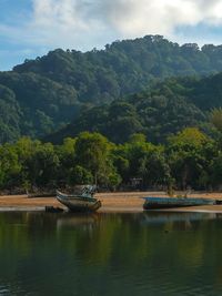 Two old fishing boats are anchored near a fisherman beach in kuala kerteh, terengganu, malaysia.