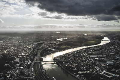 Aerial view of cityscape against sky during sunset