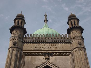 Low angle view of statue against sky