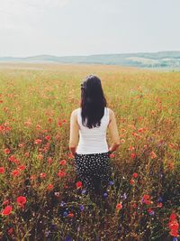 Woman standing on field