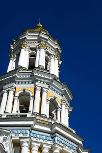 Low angle view of temple building against clear blue sky