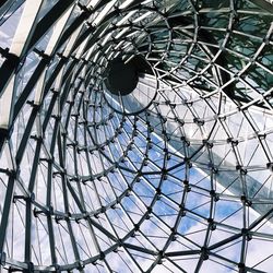 Low angle view of greenhouse against sky