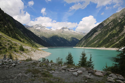 Scenic view of lake and mountains against sky