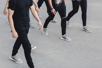 Low section of woman standing on tiled floor