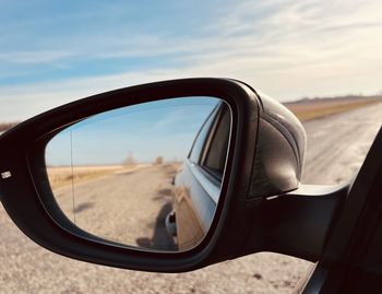 Reflection of road on side-view mirror