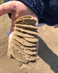 Close-up of hand holding ice cream